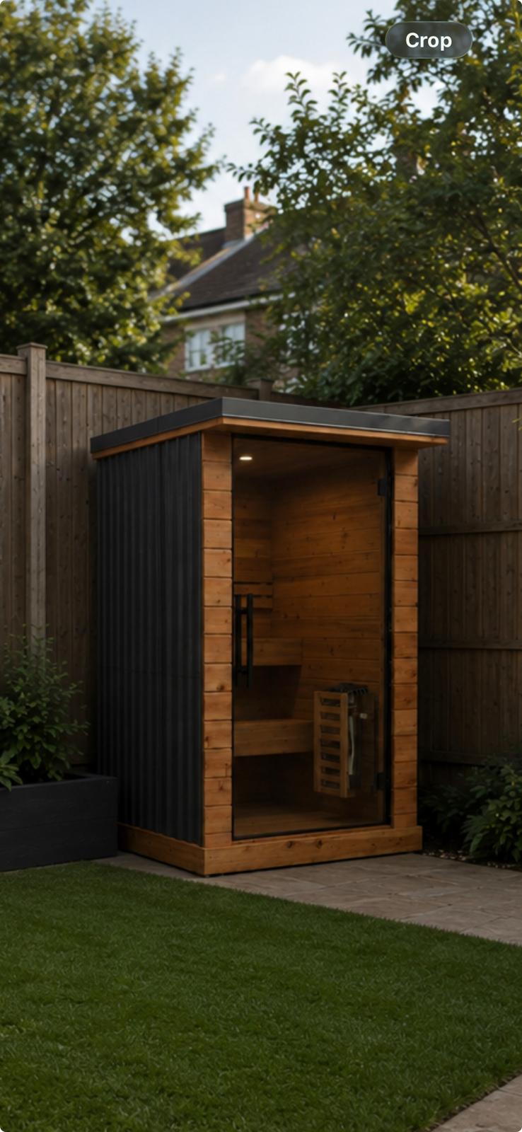 Black tin and wood 2 man outdoor sauna in a garden